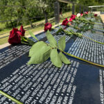 Flowers on name plaques of Eldridge Memorial